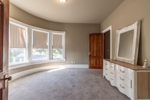 unfurnished bedroom featuring light colored carpet