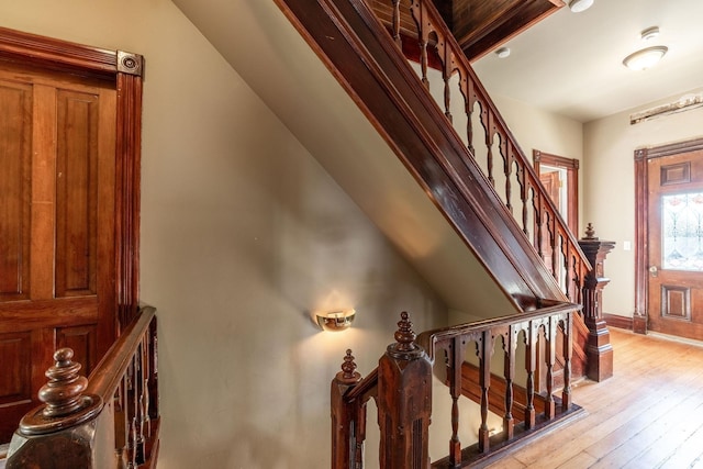 stairs featuring wood-type flooring