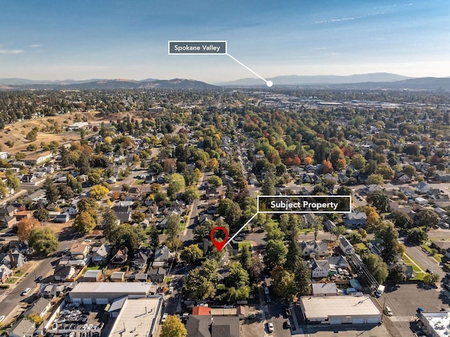 birds eye view of property with a mountain view