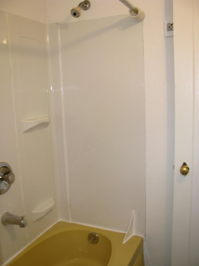 bathroom with shower / washtub combination