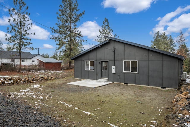 rear view of property featuring a patio area