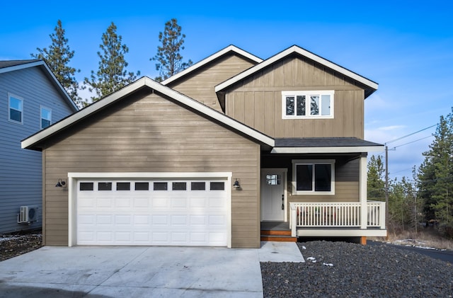 craftsman house with covered porch, a garage, and ac unit