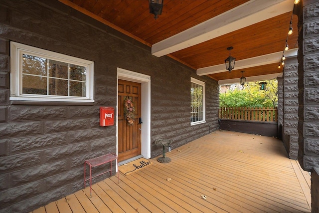 wooden terrace with a porch