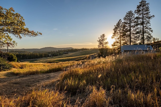 mountain view featuring a rural view