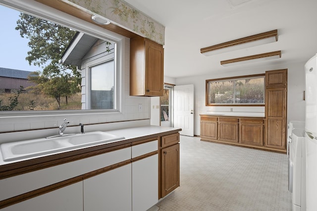 kitchen featuring backsplash and sink