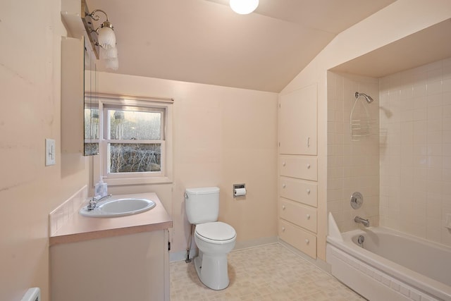 full bathroom with toilet, vanity, tiled shower / bath combo, and vaulted ceiling