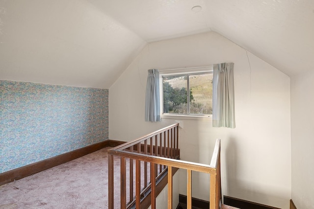 additional living space featuring vaulted ceiling