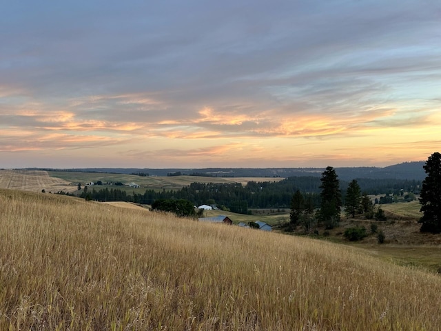 view of mountain feature with a rural view