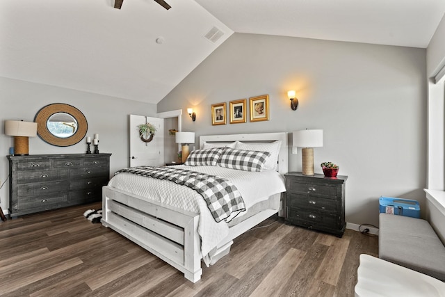 bedroom with ceiling fan, dark hardwood / wood-style flooring, and lofted ceiling