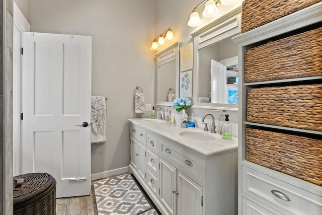 bathroom featuring hardwood / wood-style flooring and vanity