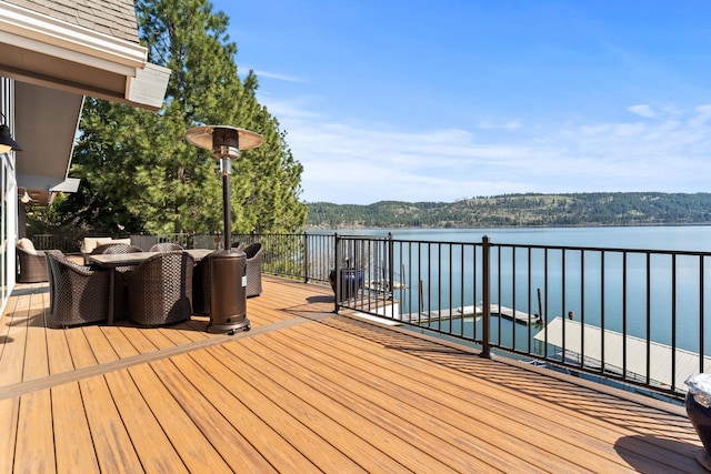 wooden deck featuring a water view