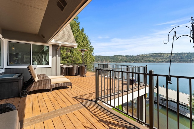 wooden terrace with a water view