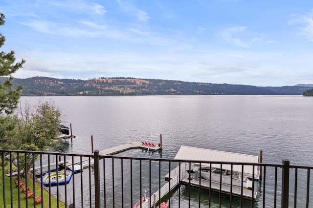 dock area with a water and mountain view