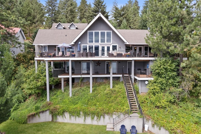 rear view of property with a wooden deck