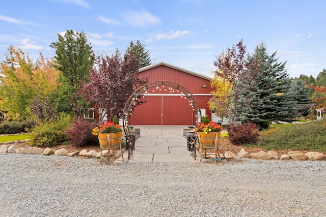 view of front of house with an outbuilding