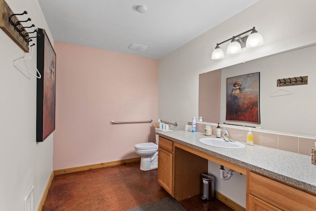 bathroom with toilet and sink