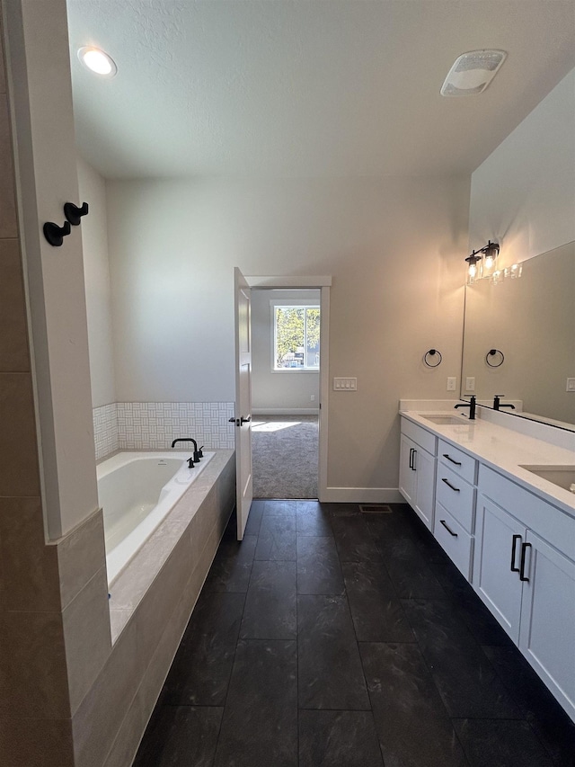 6010 N Windsor St, Spokane, WA 99208 - full bathroom featuring double vanity, baseboards, recessed lighting, a bath, and a sink