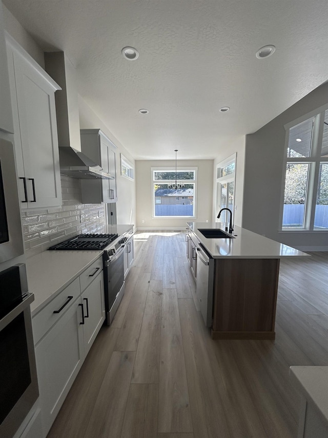 6010 N Windsor St, Spokane, WA 99208 - kitchen featuring recessed lighting, appliances with stainless steel finishes, a sink, and wood finished floors