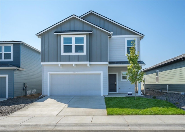 view of front of home featuring a garage and a front yard