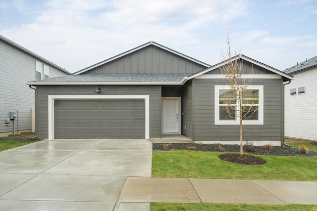 view of front of home with a garage and a front yard