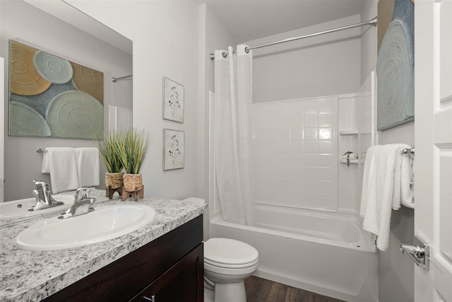 full bathroom featuring toilet, vanity, shower / bath combo with shower curtain, and hardwood / wood-style floors