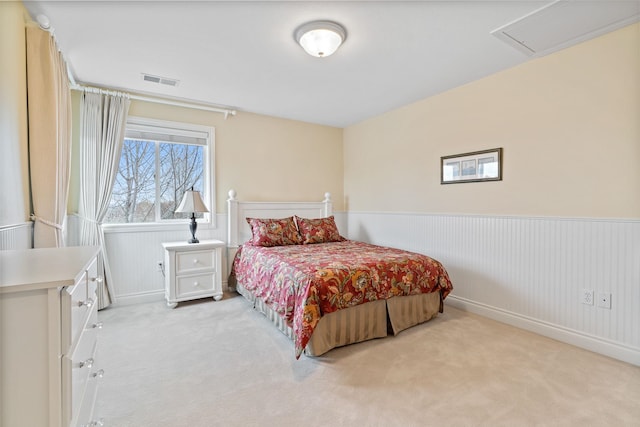 bedroom featuring light colored carpet