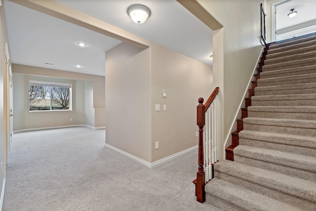 stairway with carpet flooring