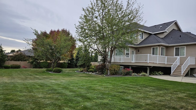 view of yard with a wooden deck