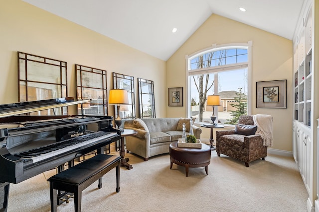 living area with lofted ceiling and light colored carpet