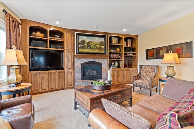 carpeted living room with a tiled fireplace