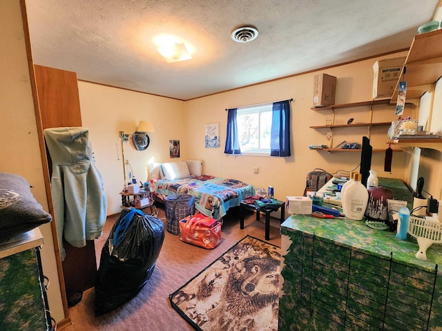 bedroom with a textured ceiling, carpet, and crown molding