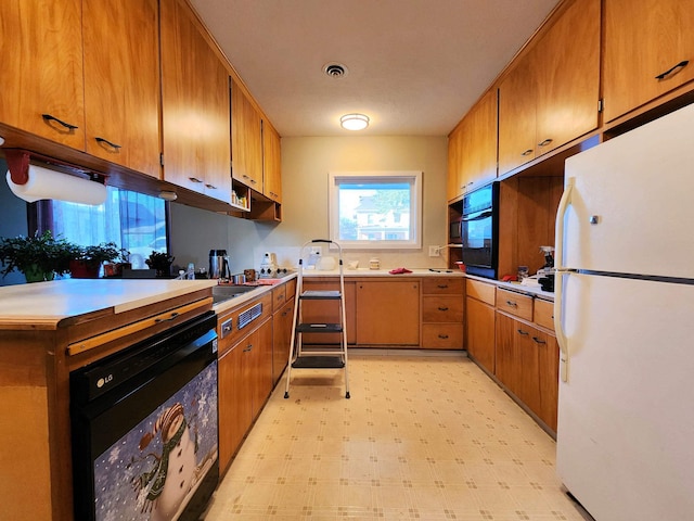 kitchen featuring white fridge, wine cooler, and oven