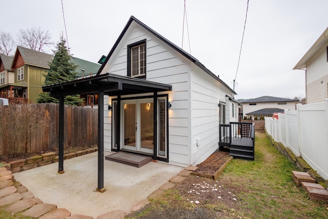 rear view of house with french doors and a patio