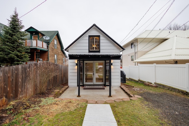 rear view of house with an outdoor structure