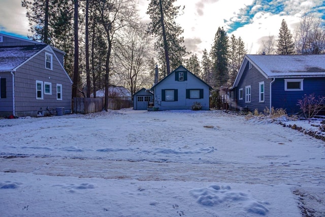 yard layered in snow with cooling unit