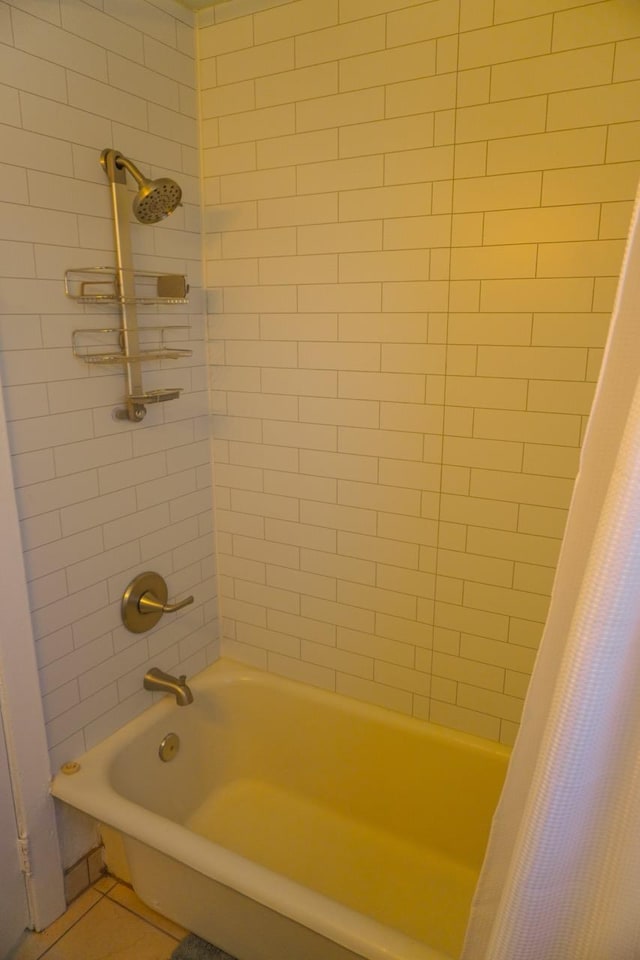 bathroom with tile patterned floors and shower / bath combination with curtain