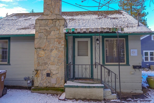 doorway to property featuring cooling unit