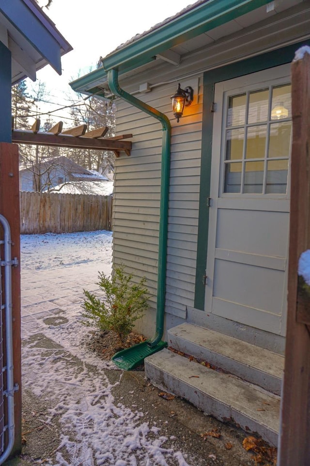 view of snow covered property entrance