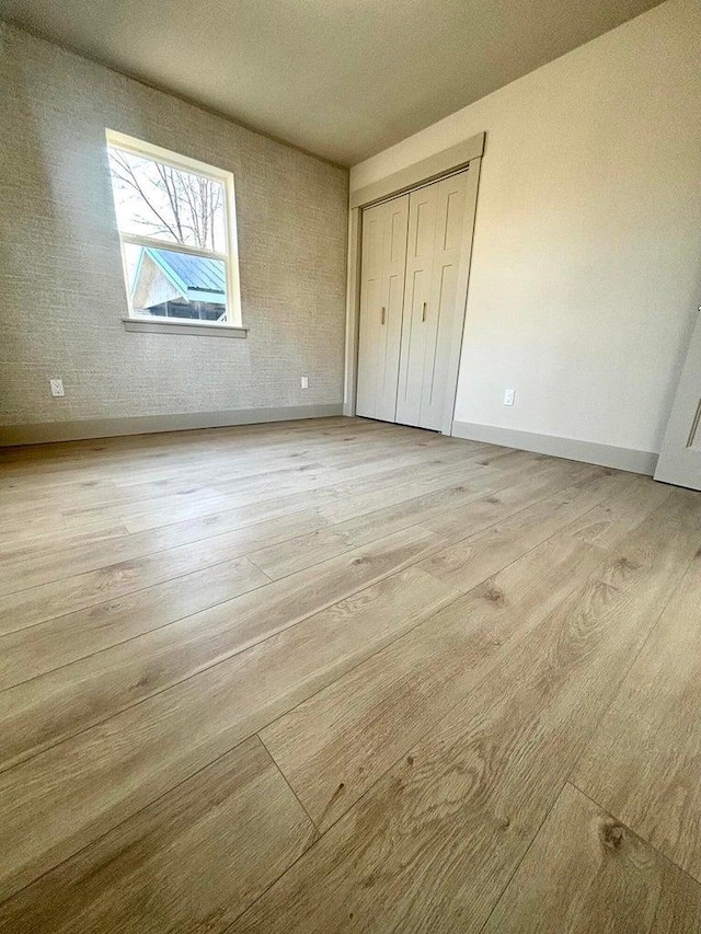 unfurnished bedroom with light hardwood / wood-style floors