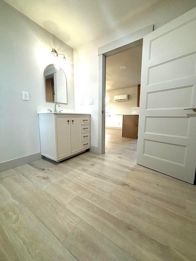 bathroom with wood-type flooring and vanity