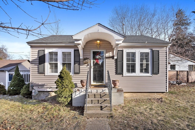 bungalow with a front yard