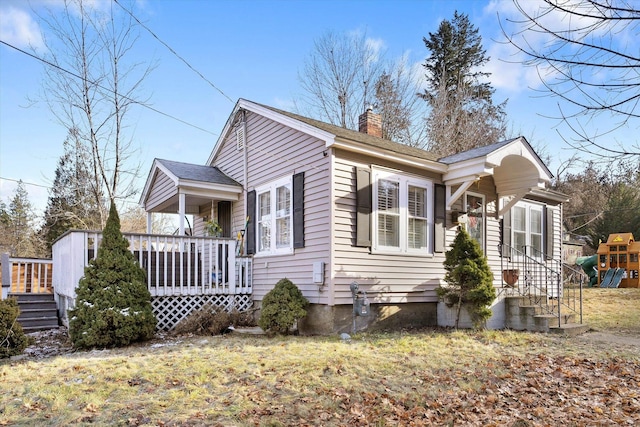 view of property exterior with a deck