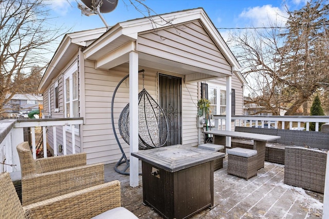 exterior space featuring a wooden deck and an outdoor hangout area