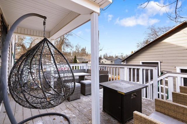 view of patio / terrace featuring an outdoor living space with a fire pit and a deck