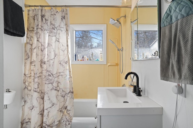 bathroom with shower / bath combination with curtain and vanity