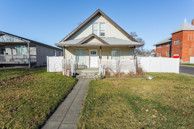 bungalow-style home with a front lawn