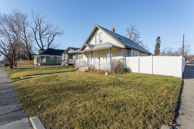 view of home's exterior featuring a yard