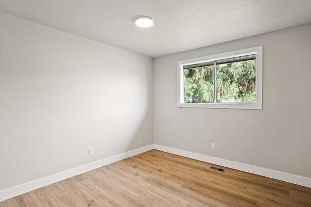 unfurnished room with light hardwood / wood-style floors