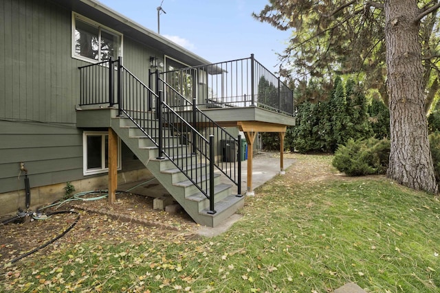 view of property exterior featuring a yard and central AC unit