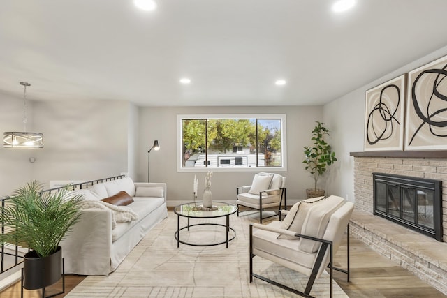 living room featuring light hardwood / wood-style flooring and a fireplace